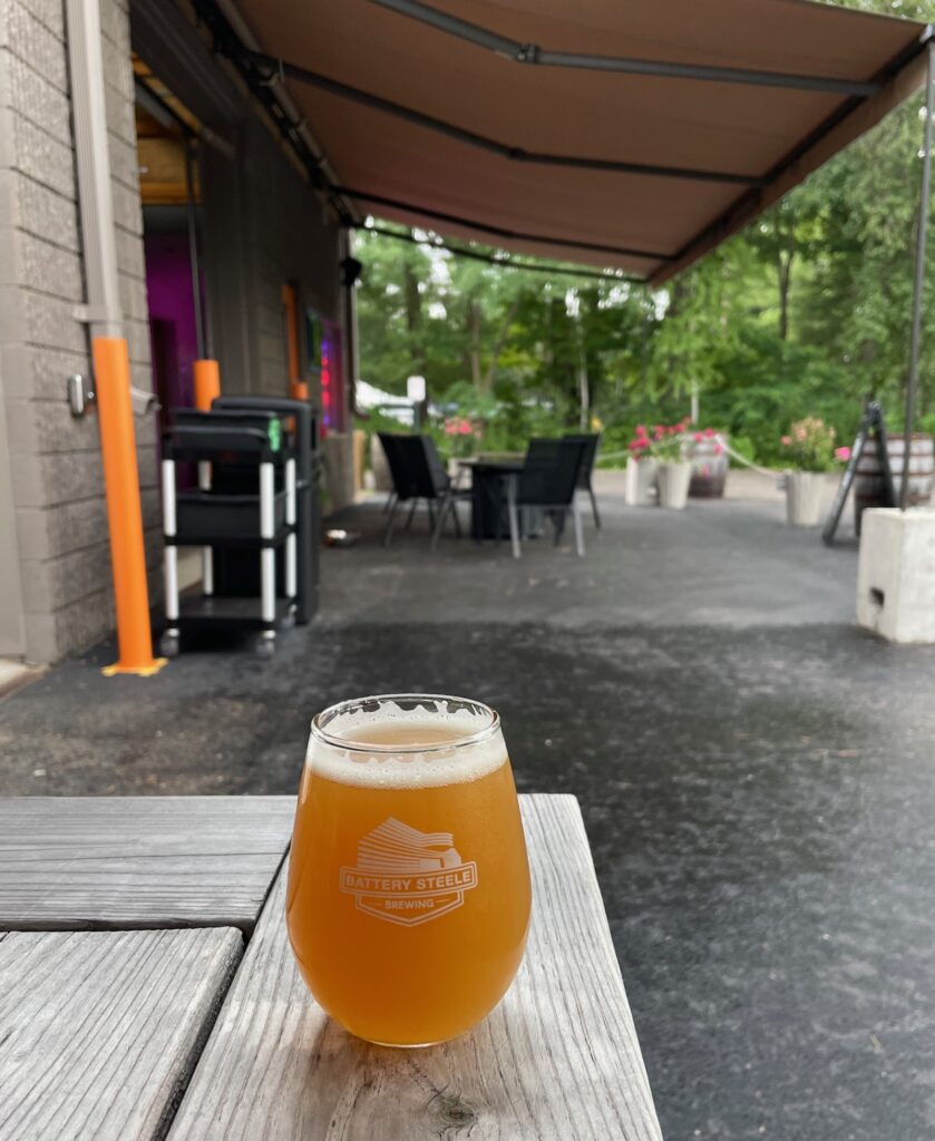 an IPA at Battery Steele on the back patio