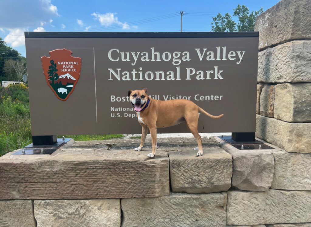 Bugsy in front of the Cuyahoga Valley National Park sign