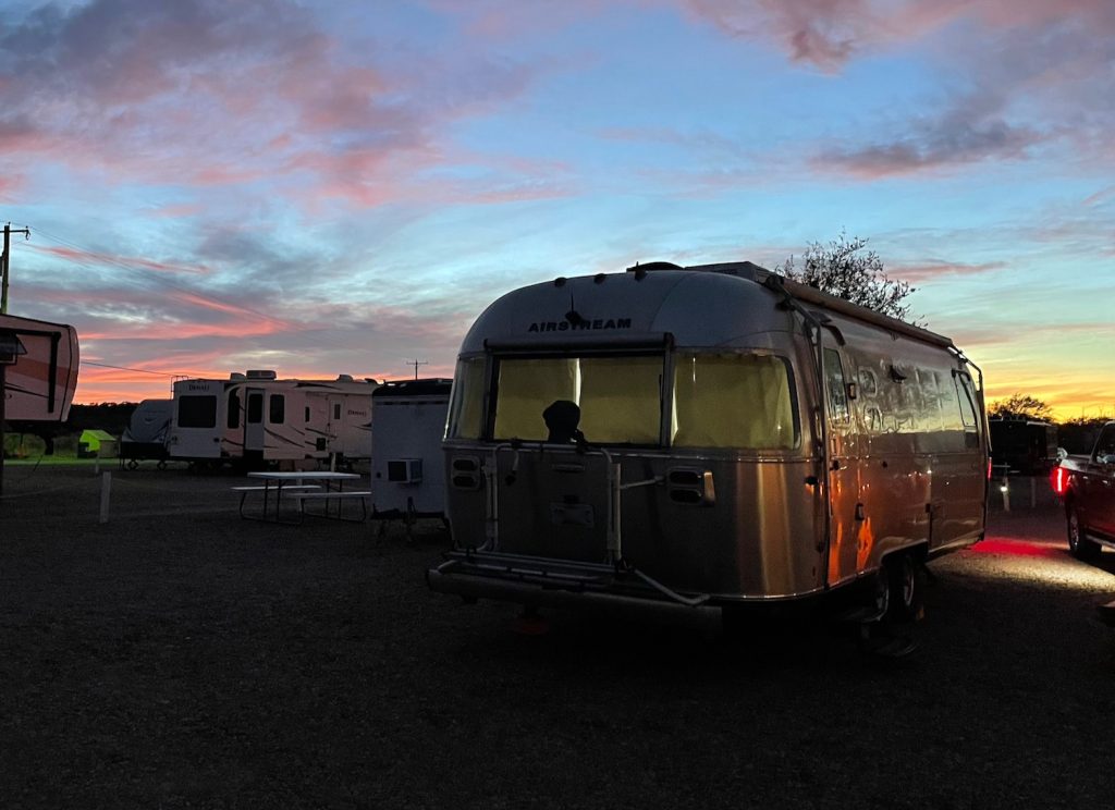 the Airstream at sunset at the campground